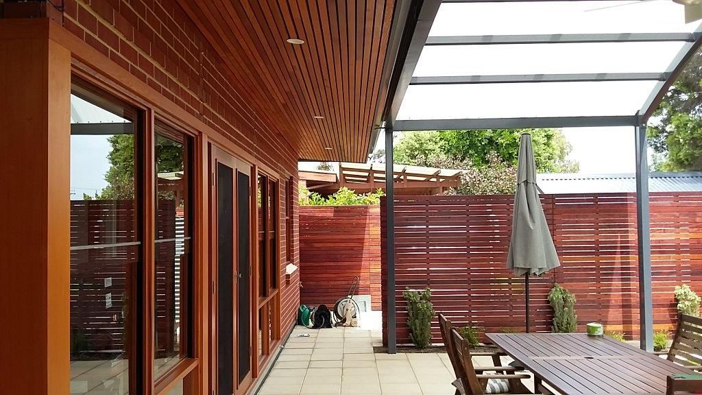 Family room Extension and verandah to Red Brick and stone Cottage Kent Town SA: External showing Cedar Eaves and Privacy screens